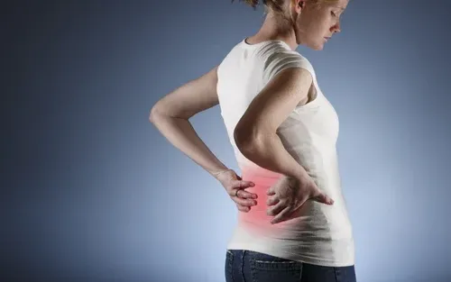 Woman holding her lower back